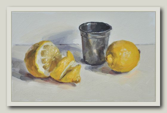 Lemons and tin cup