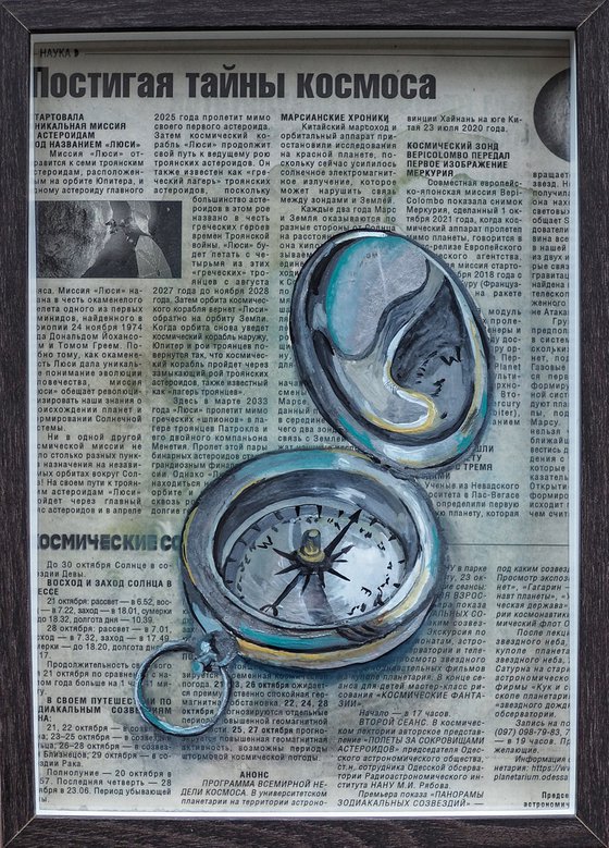 Compass on newspaper