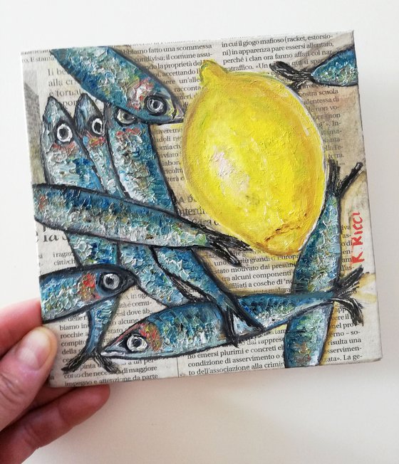 Fishes with Lemon on Newspaper