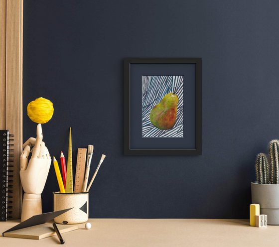 Green pear on blue