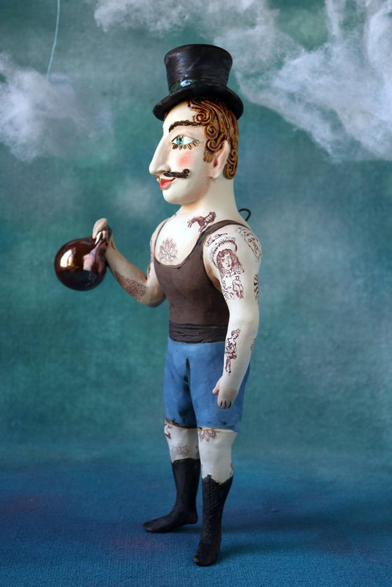 Vintage Strongman with zylinder hut. Wall sculpture by Elya Yalonetski.