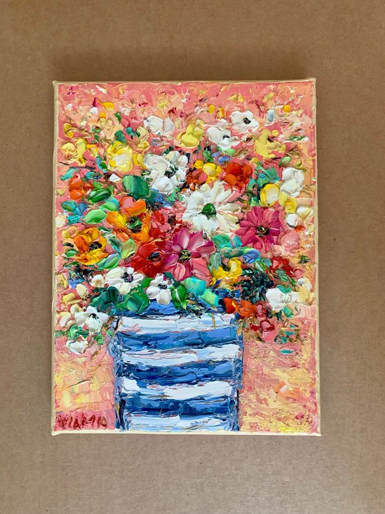 Flowers bouquet in striped vase
