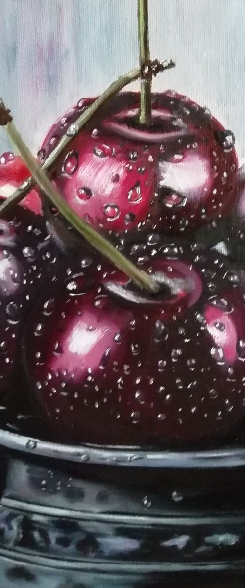 Ripe cherries in a bowl by Nataliia Plakhotnyk
