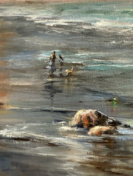 Dog walking down the beach