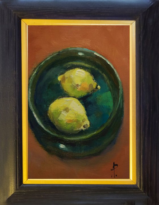Two Lemons in Green Bowl