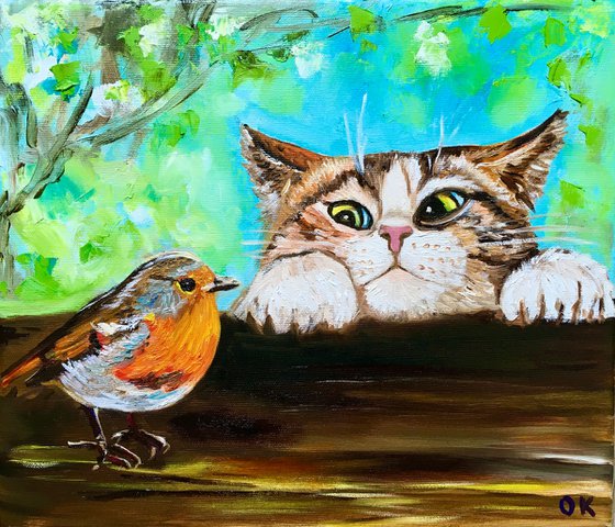 Curiosity, feline look. Cat and robin.  Spring time.