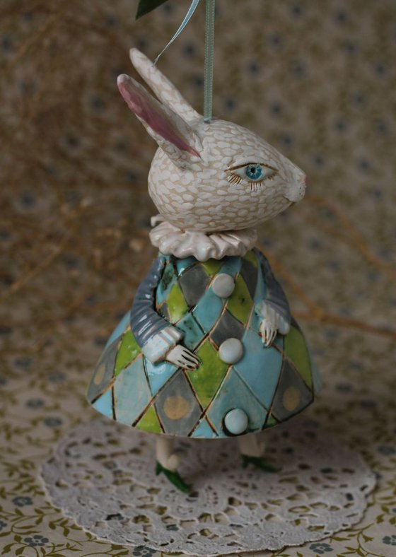 Little rabbit in harlequin dress. Hanging sculpture, bell doll by Elya Yalonetski