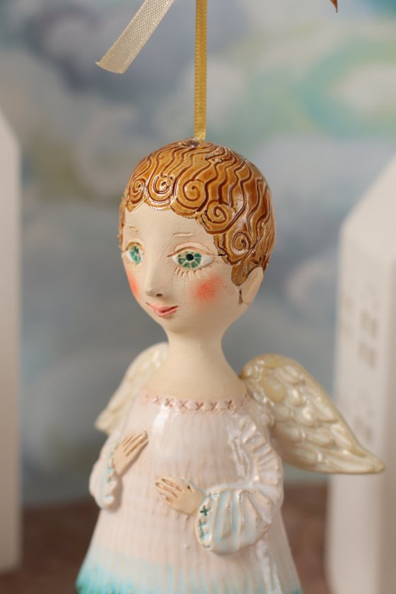Tiny hanging sculpture by Elya Yalonetski. Smiling Angel