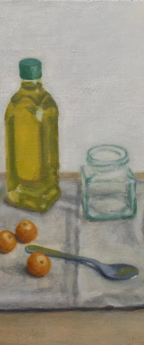 Olive oil bottle with cherry tomatoes by Hugo Lines