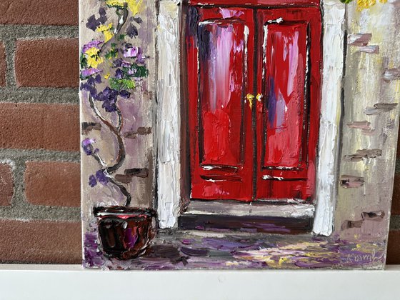 Red door with flowers