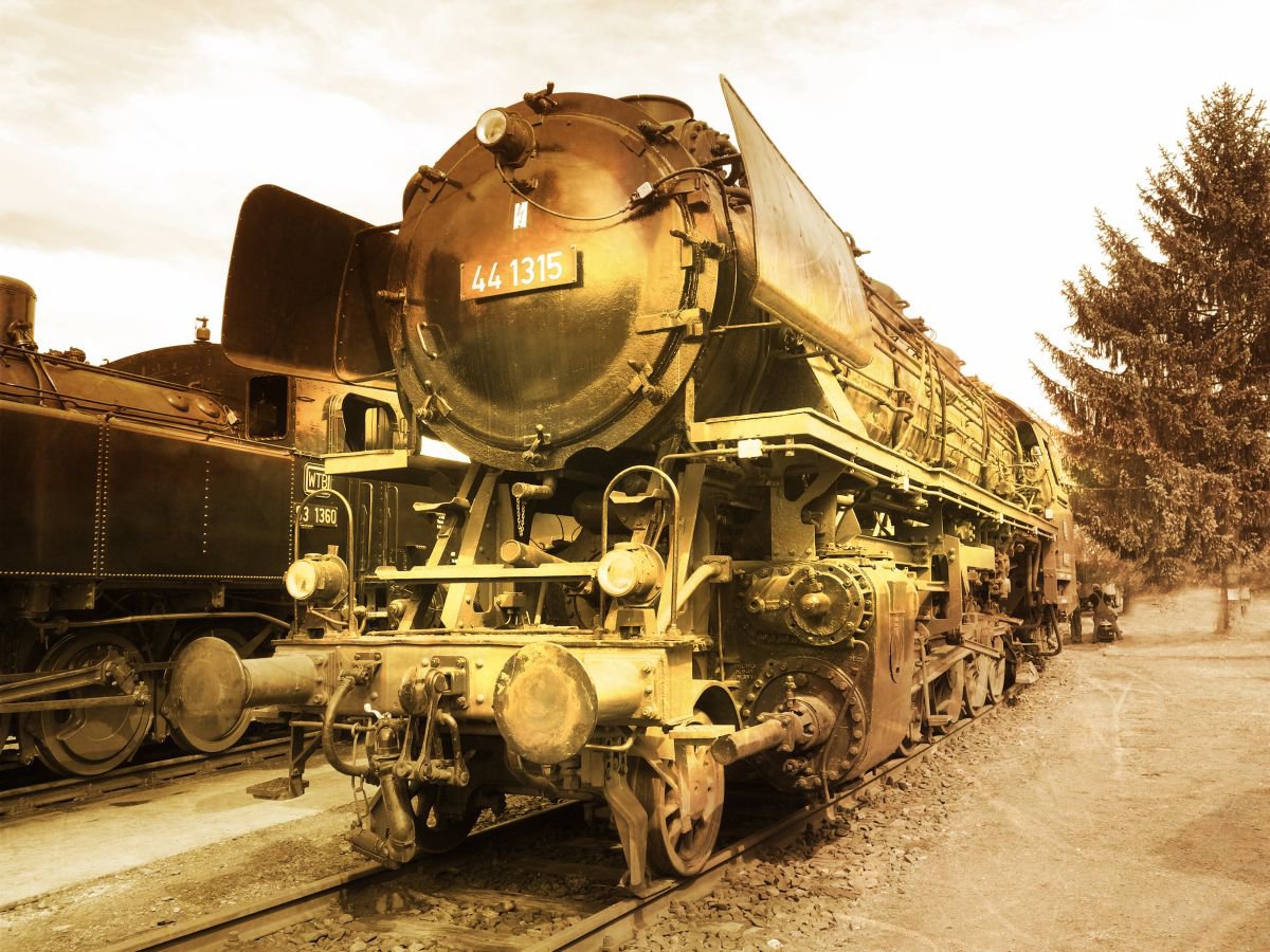 Old steam trains in the depot - print on canvas 60x80x4cm - 08373m1 by Kuebler