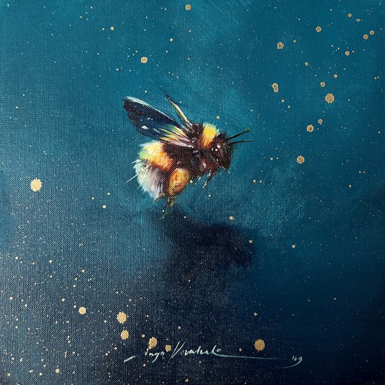 This is a honey bumblebee in flight