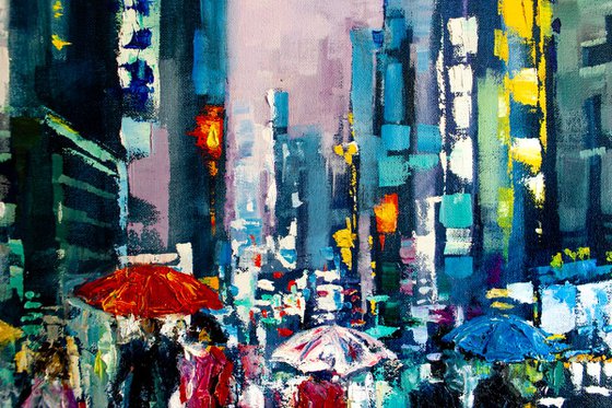 "Night city lights" ,  people with umbrellas