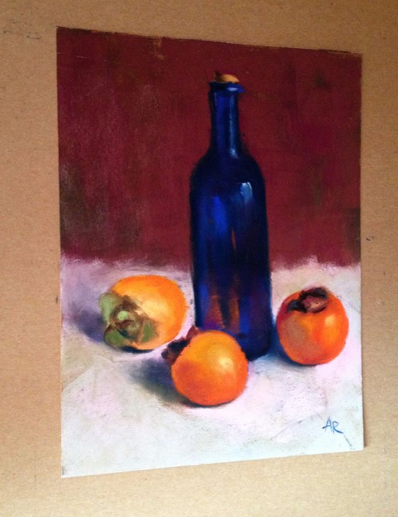 Persimmons and blue bottle