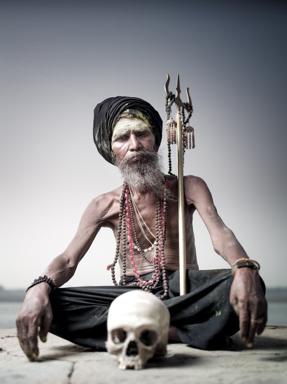 Portrait of Sadhu Aghori Baba with human skull
