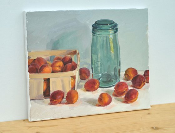 Apricots in a crate and old jar