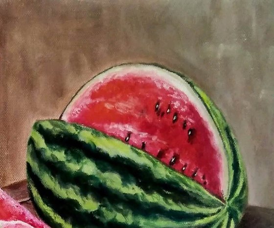 Watermelon and a flask of wine