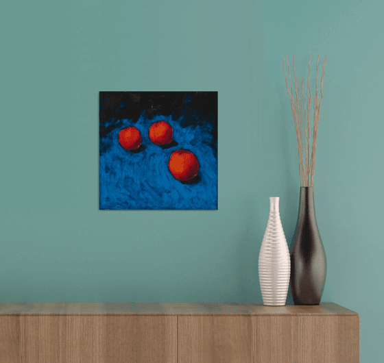 modern still life of peaches with blue background