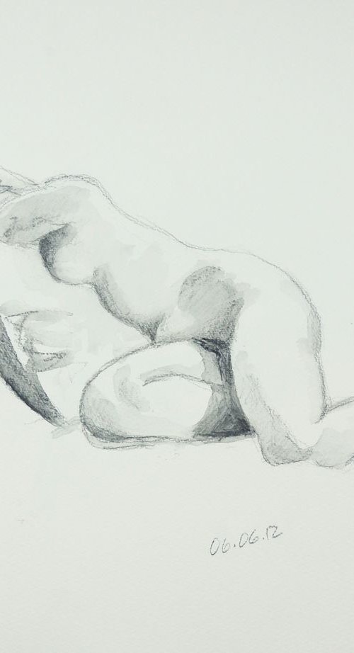 A pencil sketch of a reclining human figure. The body is drawn with soft shading to indicate the contours and muscles. One arm is bent and the legs are slightly crossed. The date "06.06.12" is written in the lower right corner, next to the name "Amanda." The sketch is minimalist with a focus on form.