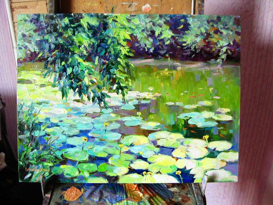 Overgrown pond with water lilies