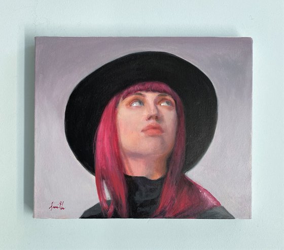 Contemporary portrait of a young woman with a hat.
