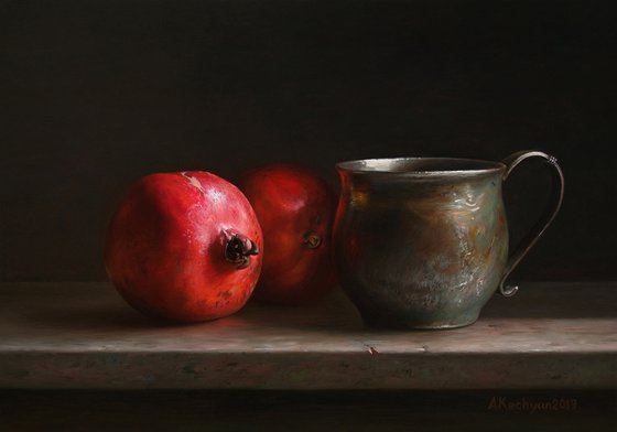 Pomegranates with a cup