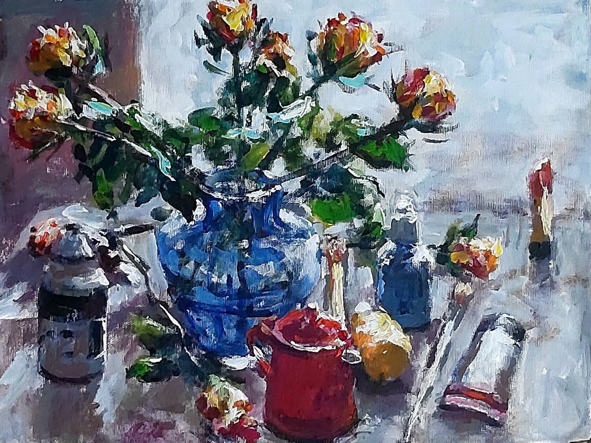 paints, brushes and roses next to a red teapot. by Dimitris Voyiazoglou