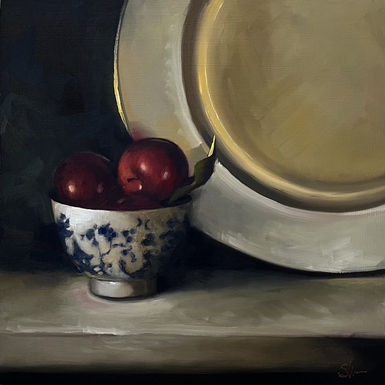 Plums and gold plate.