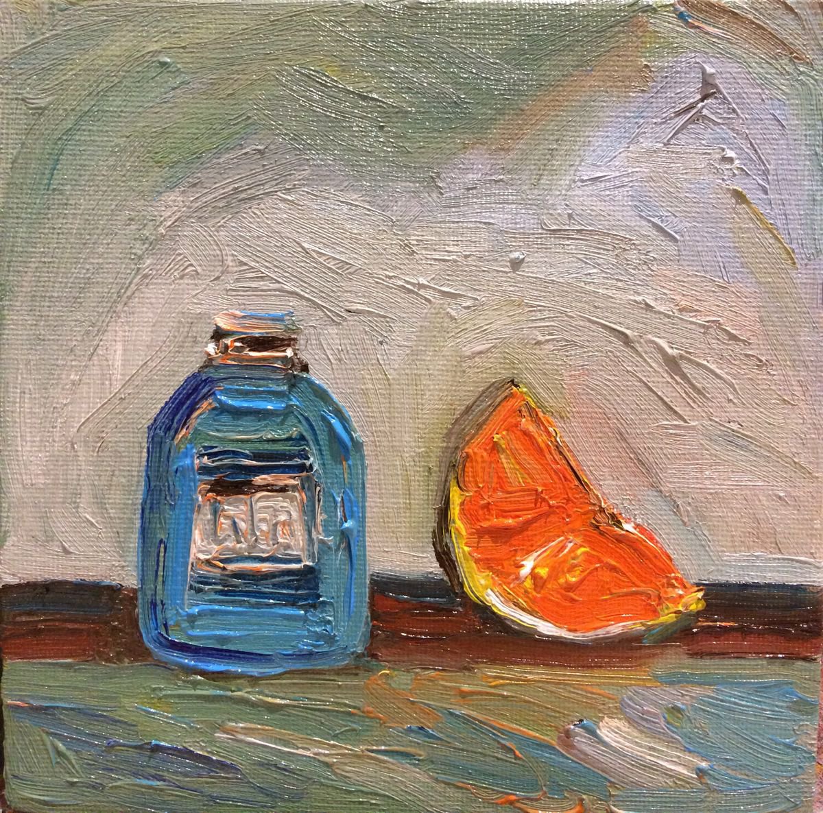 Orange slice and Blue Bottle by Ritu