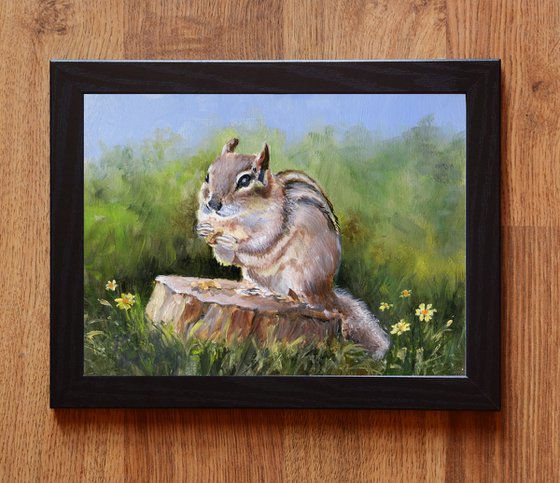 Cute chipmunk on a stump