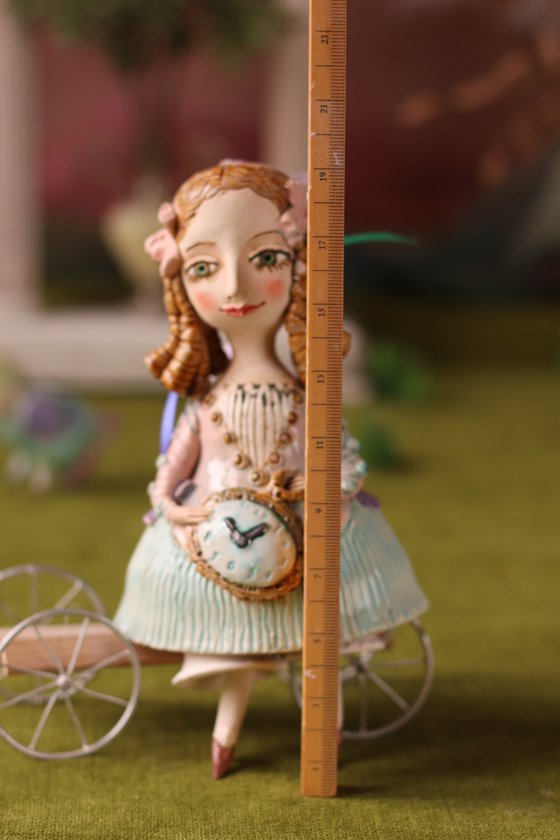 Little Girl with a clock. Hanging sculpture, bell doll by Elya Yalonetski