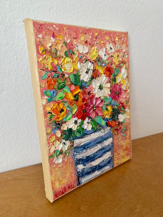 Flowers bouquet in striped vase