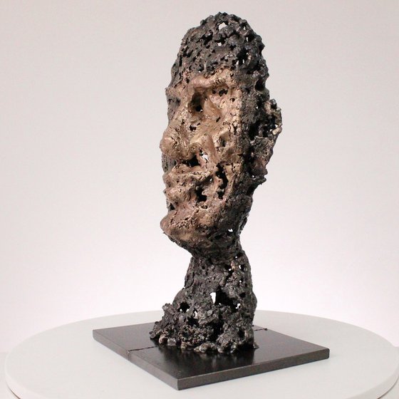 A rock - Face sculpture bronze steel