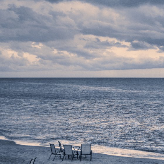 There are many empty seats in the coastal cafe before the storm.