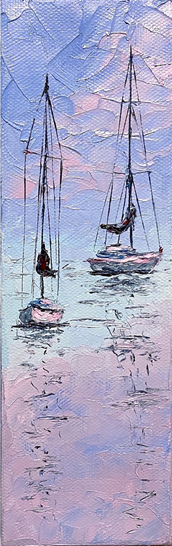 Sailboats at tender sunset