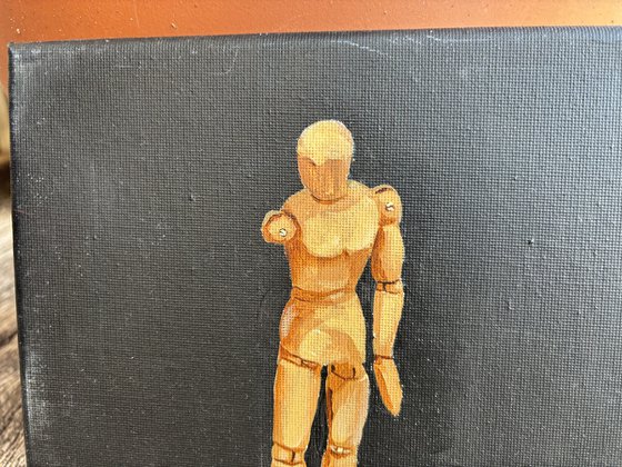 Still life with wooden figure