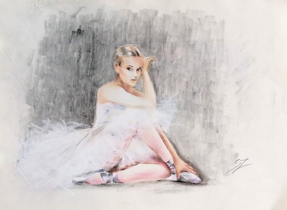 Seated ballerina with a white dress