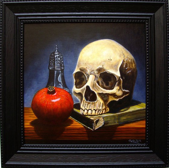 Skull on book with pomegranate