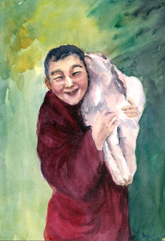 Young monk and his pet goat
