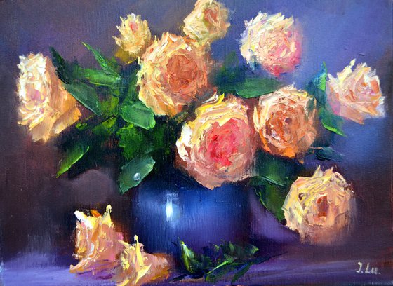 Yellow roses in a blue vase