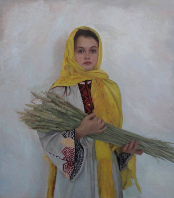 Girl with sheaves of wheat
