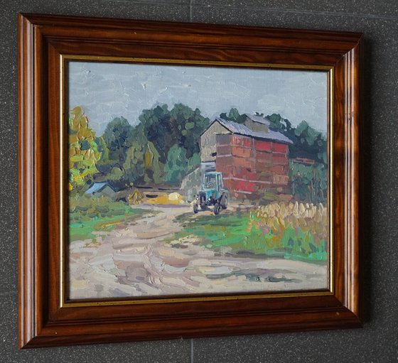 Blue tractor at the sawmill. Rodnya village