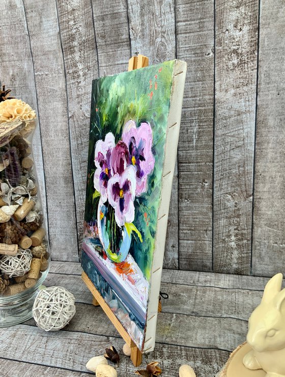 Pansies in a glass vase