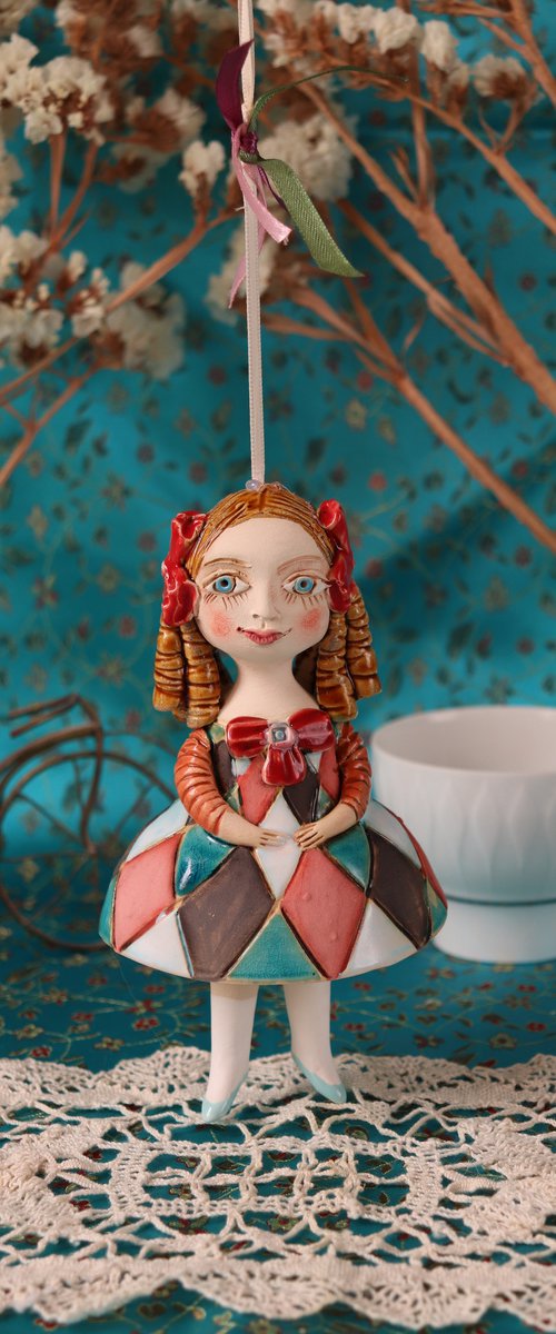 Little Girl in Harlequin dress. Tiny hanging sculpture by Elya Yalonetski