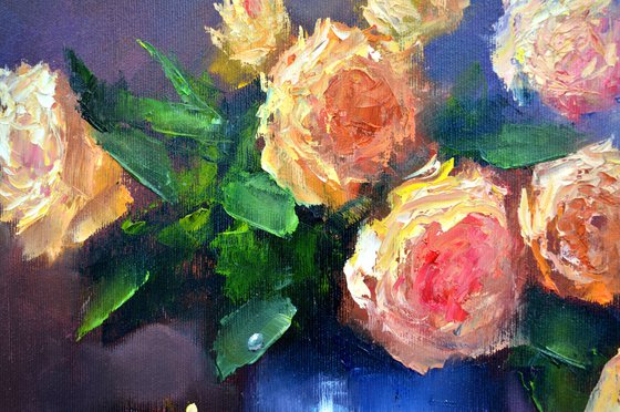 Yellow roses in a blue vase