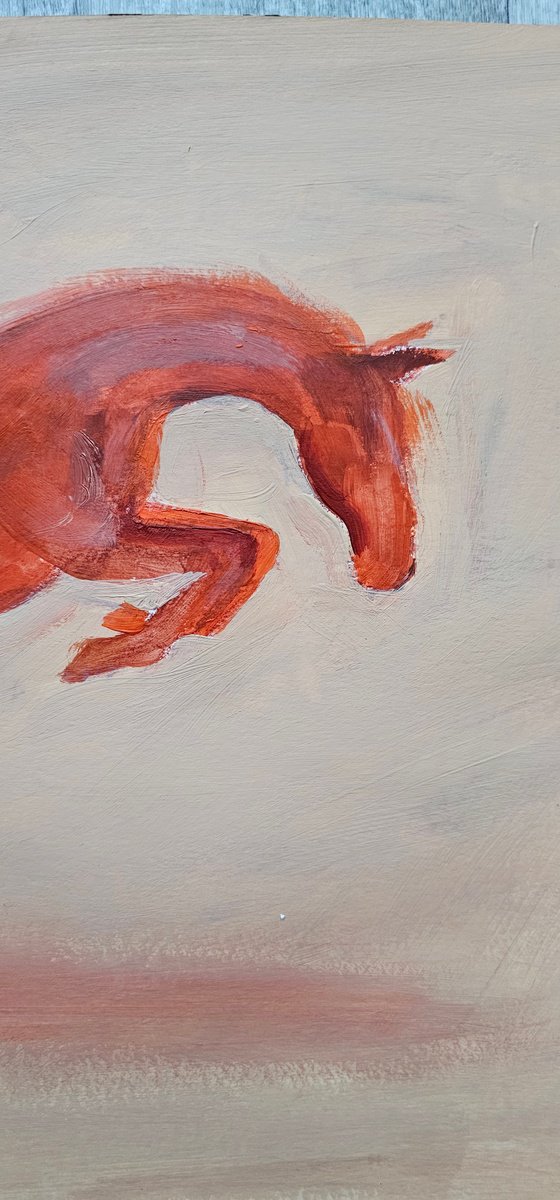 Jumping orange horse