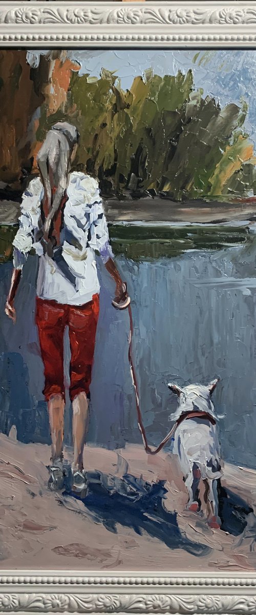 Woman walking with a dog. by Vita Schagen
