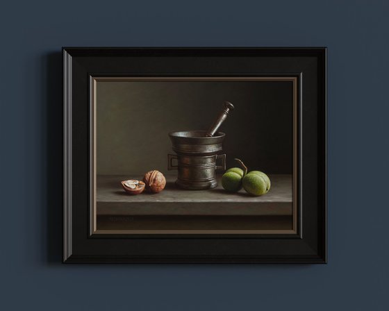 Walnuts with a bronze mortar