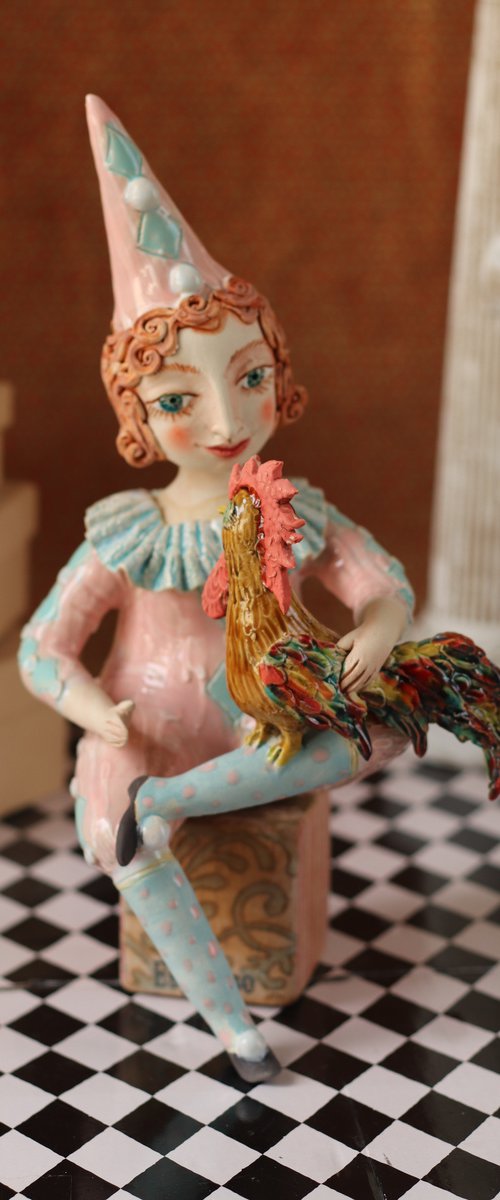 Sitting Pierrot in Blue with a Rooster by Elya Yalonetski