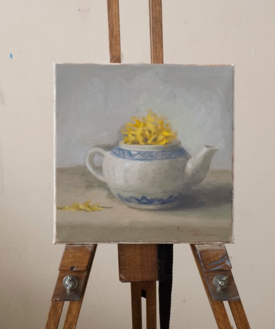 Teapot with yellow flowers
